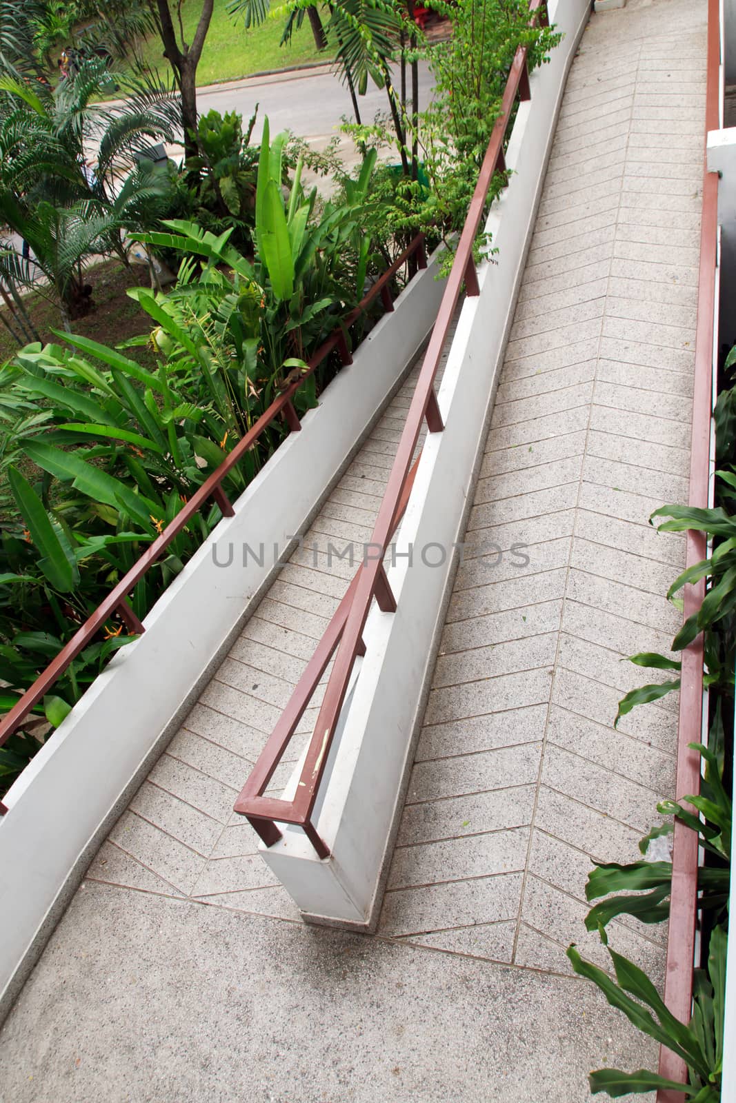Pathway made ������of bricks in various colors at garden.