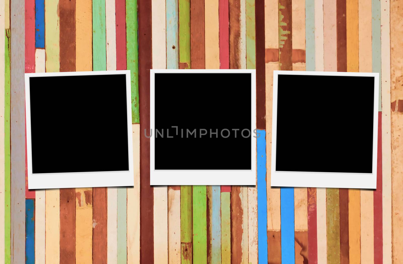 Blank instant photo frames on wooden background. 