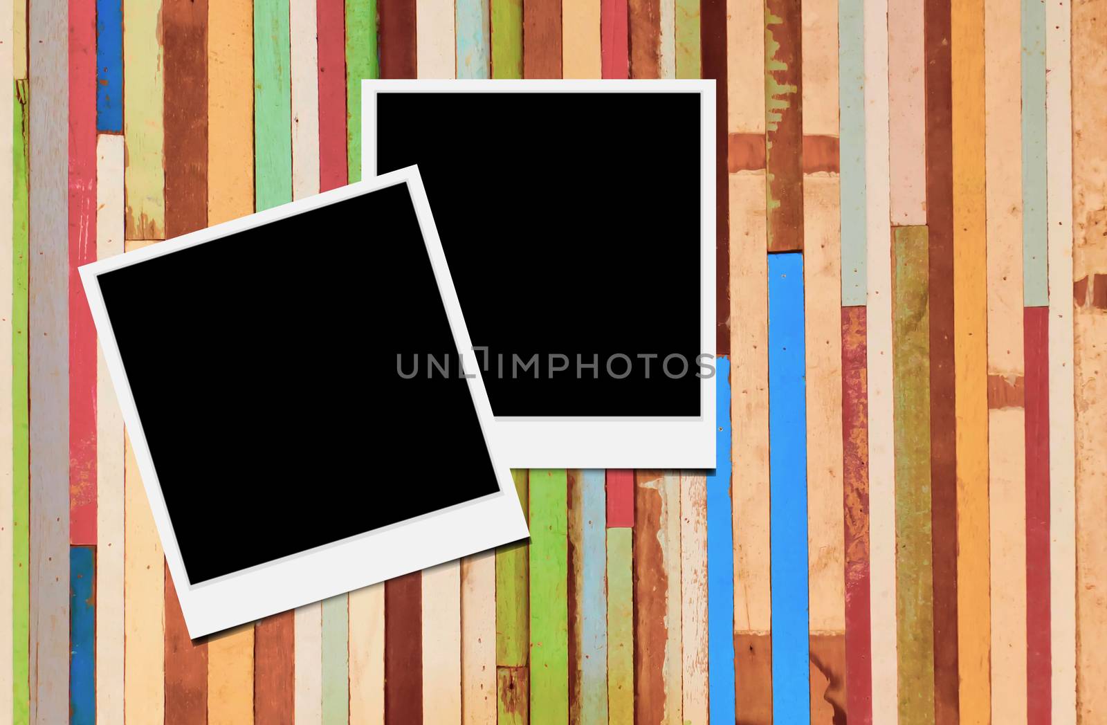 Blank instant photo frames on wooden background. 