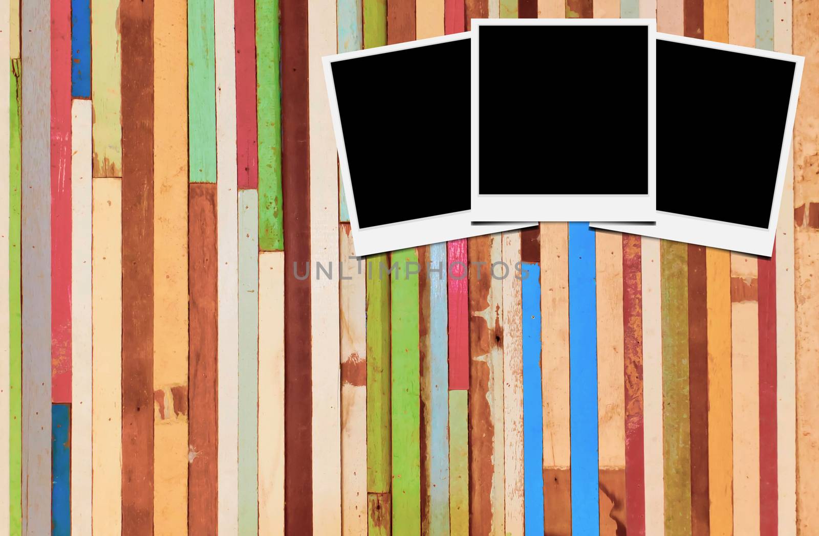 Blank instant photo frames on wooden background. 