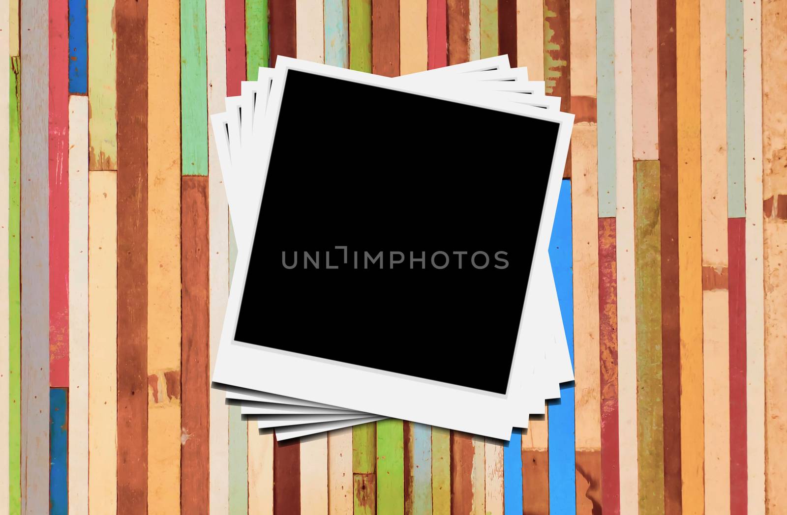 Blank instant photo frames on wooden background. 