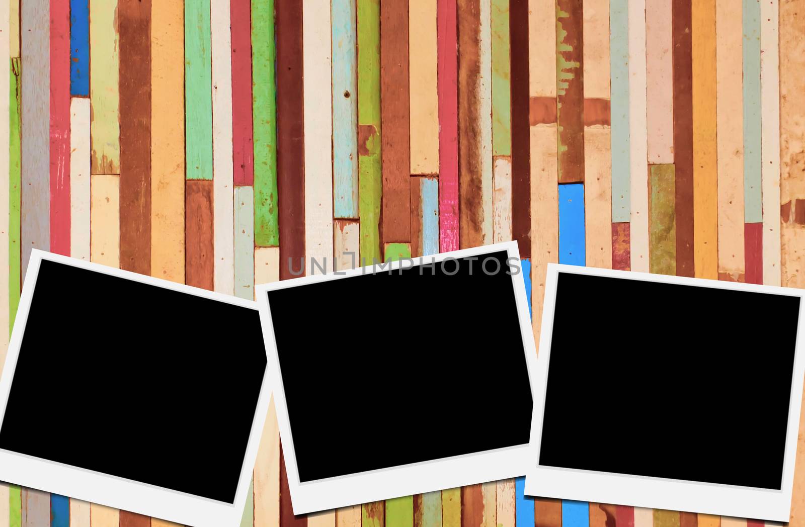 Blank instant photo frames on wooden background. 