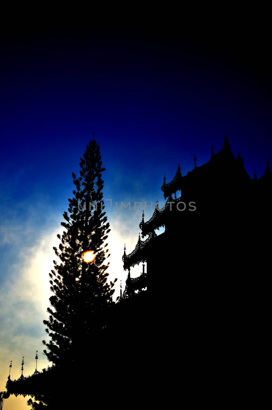 Silhouette of Buddhist Temple in the Sunrise.

