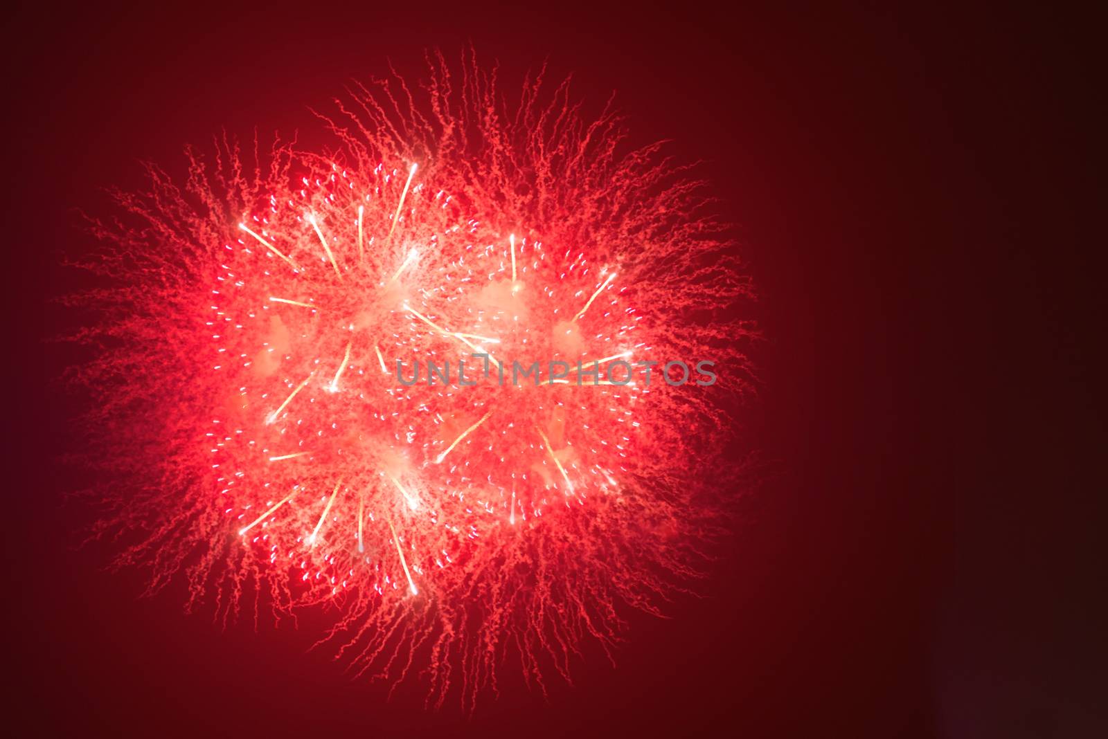 Fireworks in night dark sky with smoke after explosions