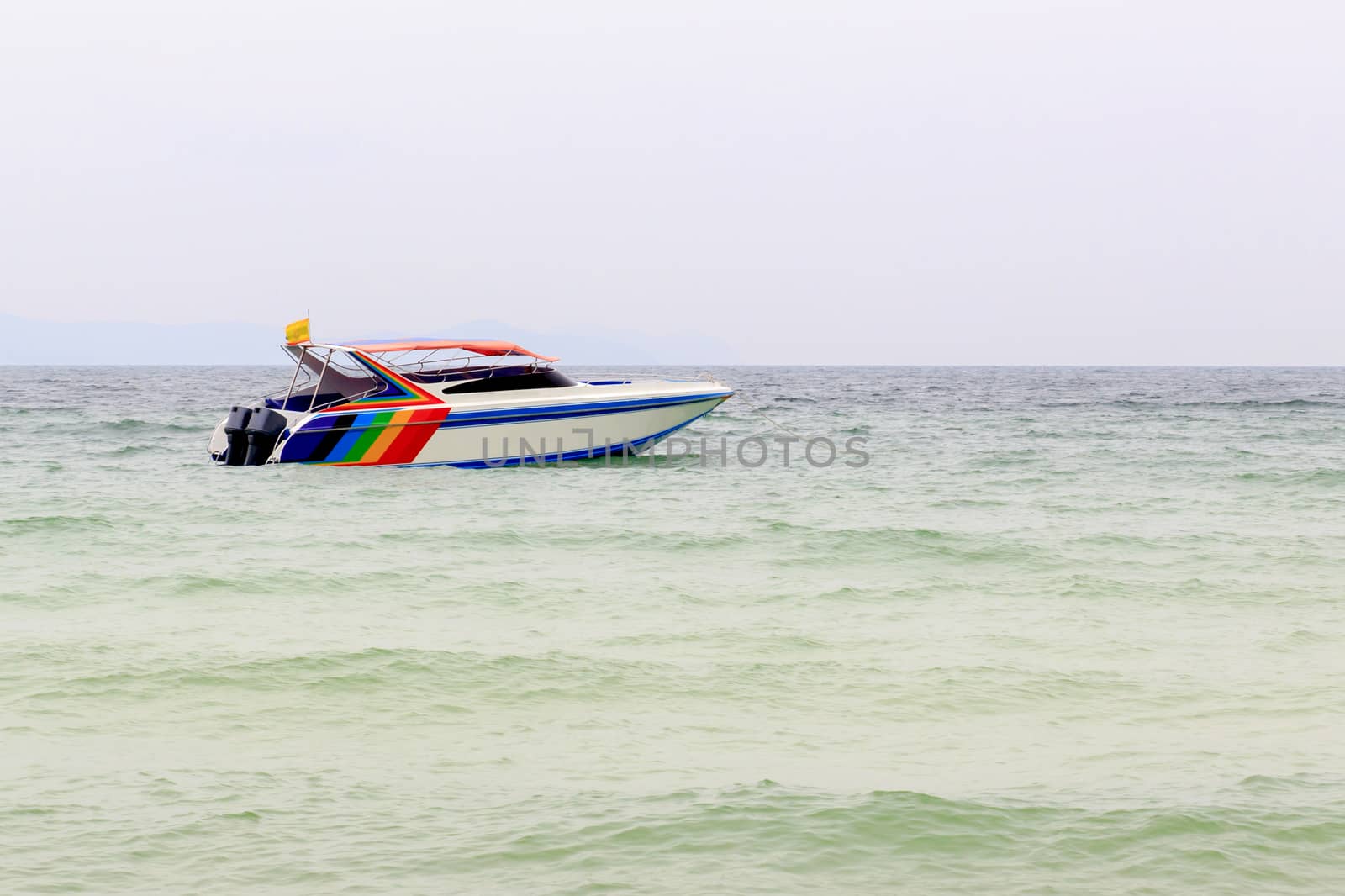 Speed boat in the landscape of sea.