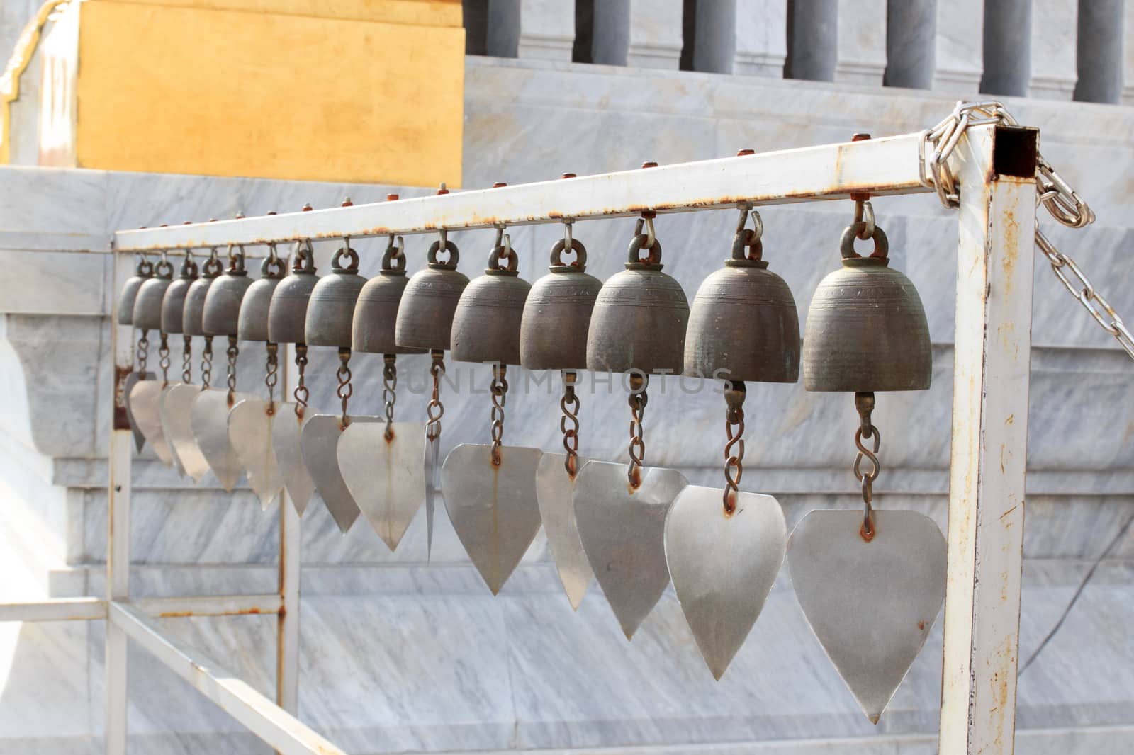 Lots of small bells hanging in the thai church.