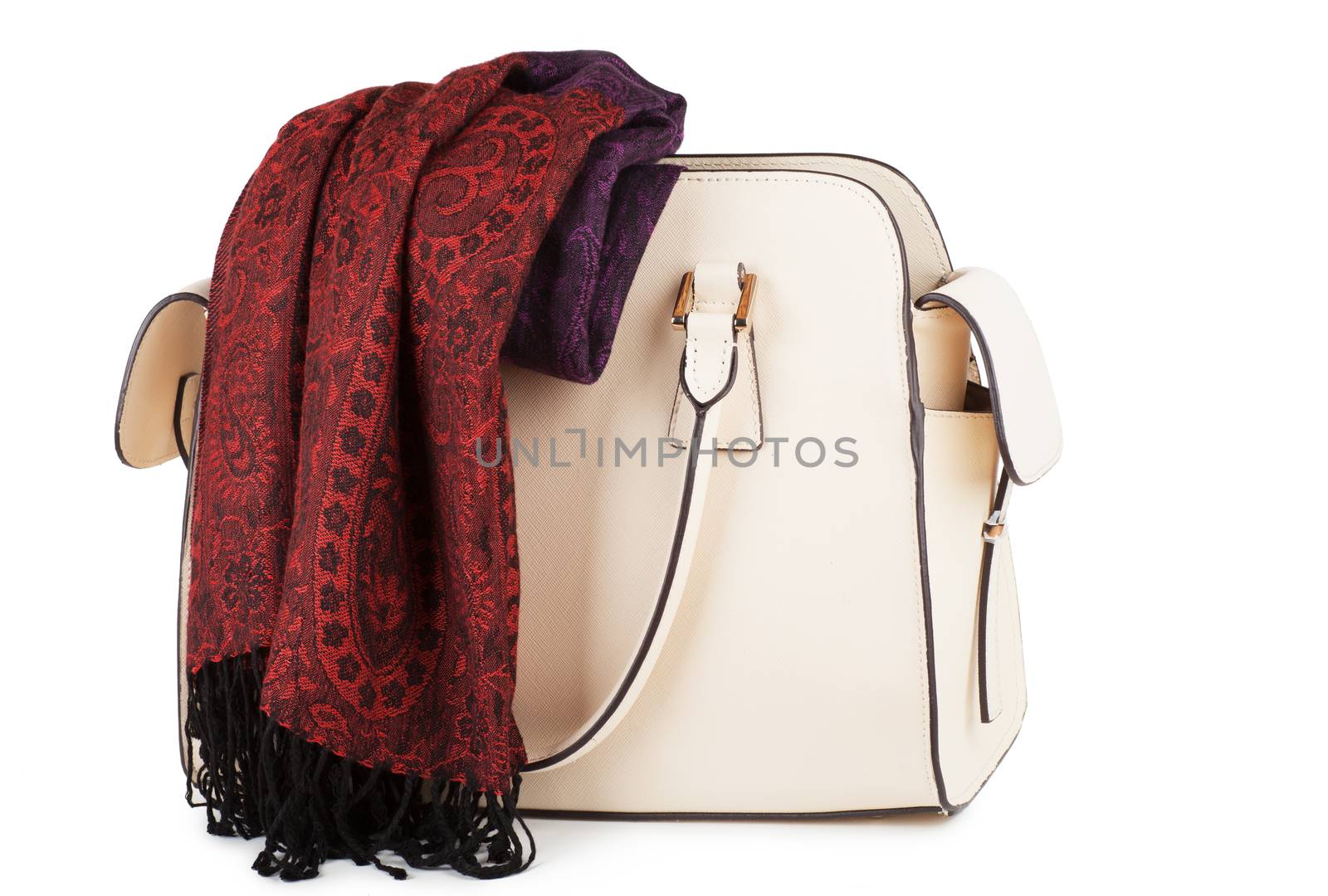 White female handbag with red scarf over white background