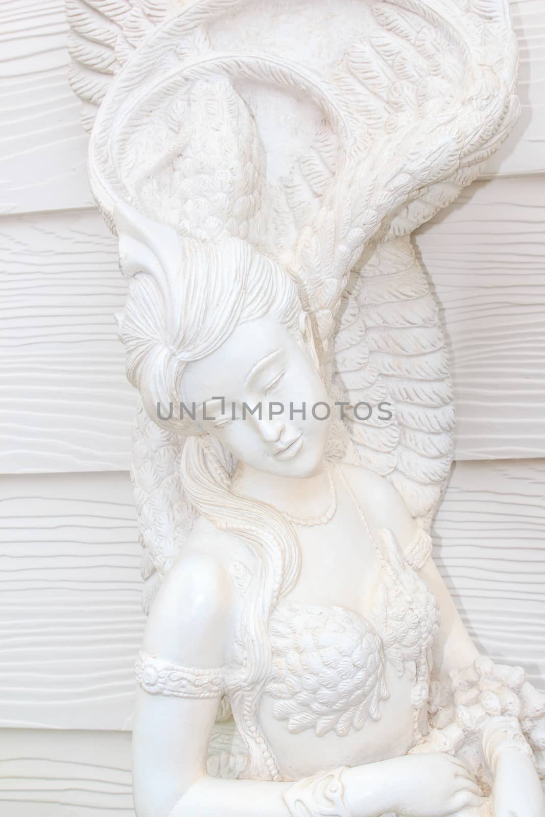 Statue of woman looks like an angel.
