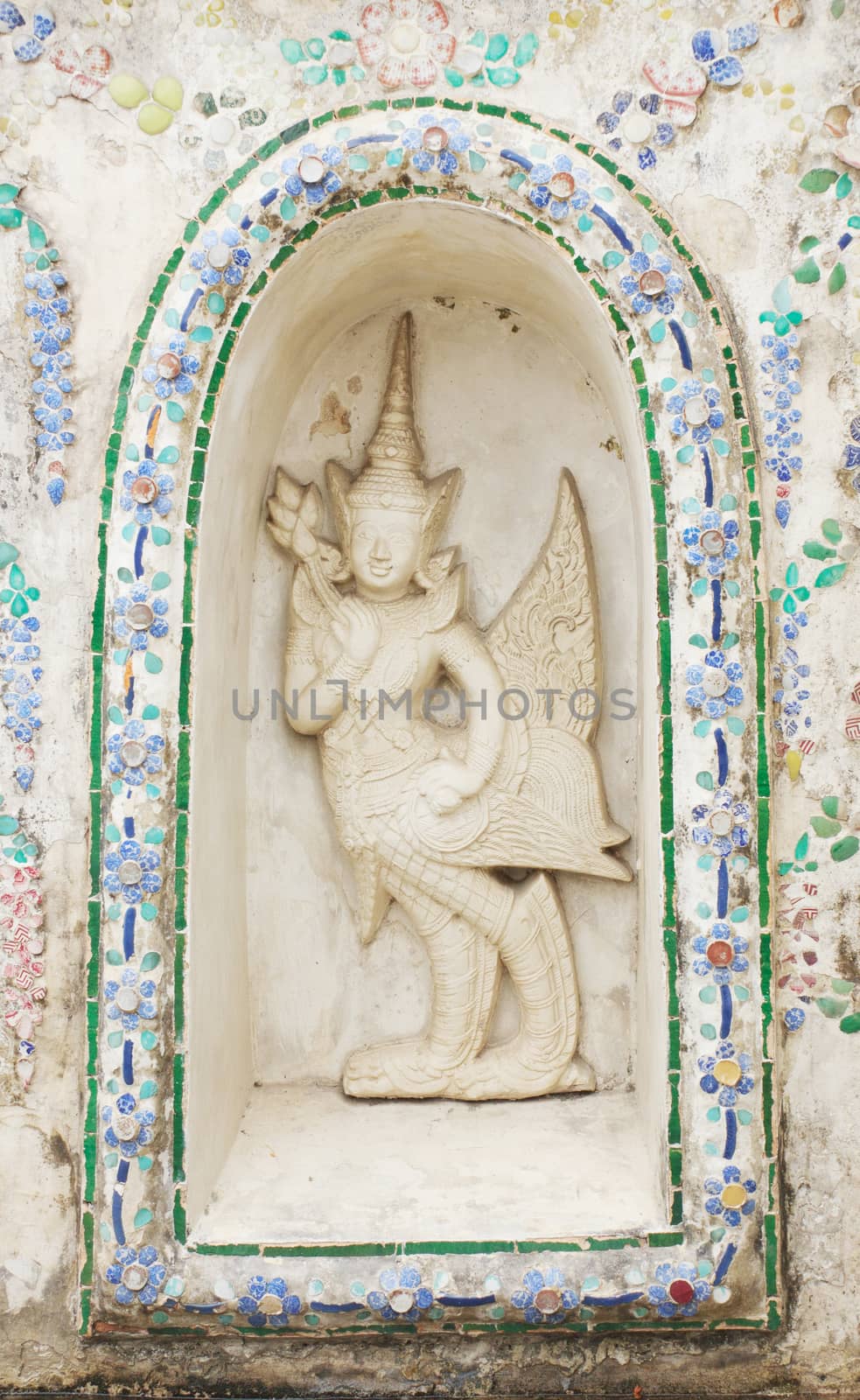 Statue of a kinnaree in Wat Arun wararam, thailand.