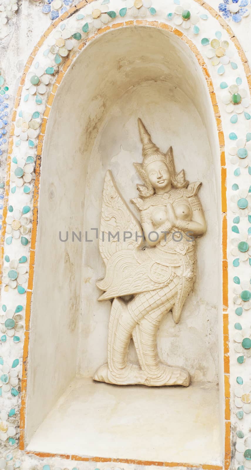 Statue of a kinnaree in Wat Arun wararam, thailand.