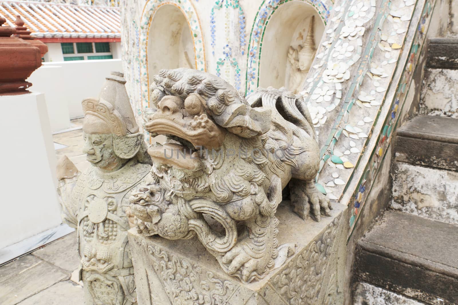 Statue of a lion chinese style in Wat Arun wararam, thailand.
