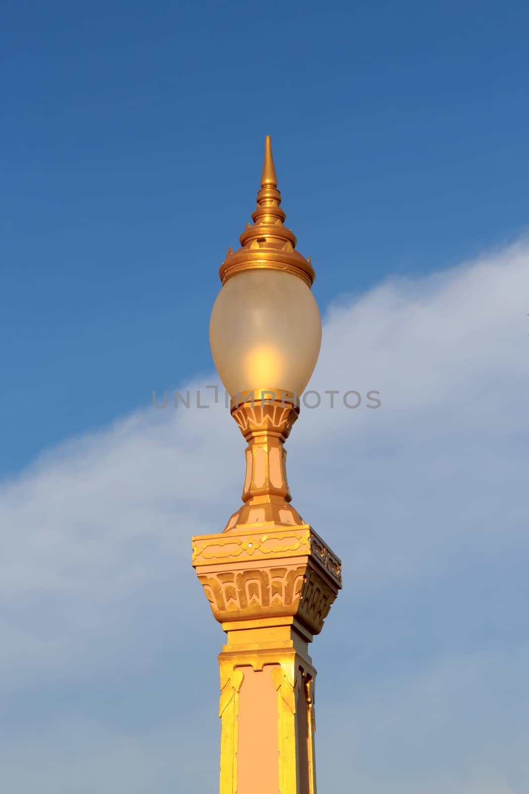 Thai street lamp on blue sky background.