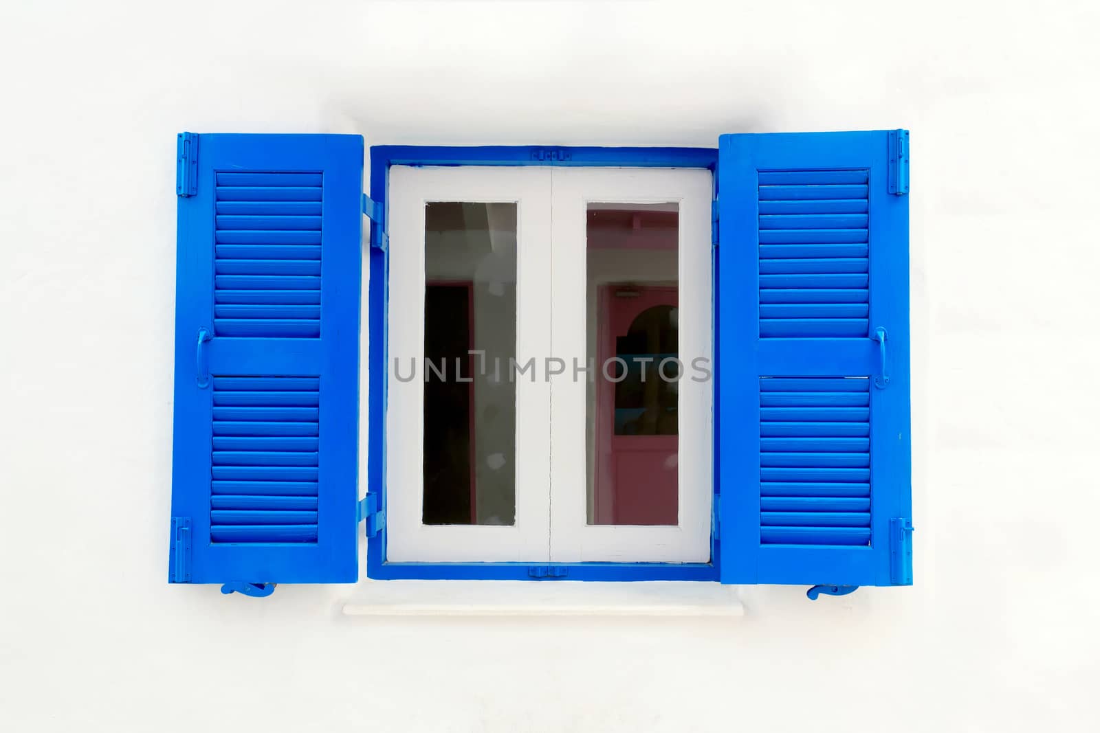 Blue window with white wall of official place.