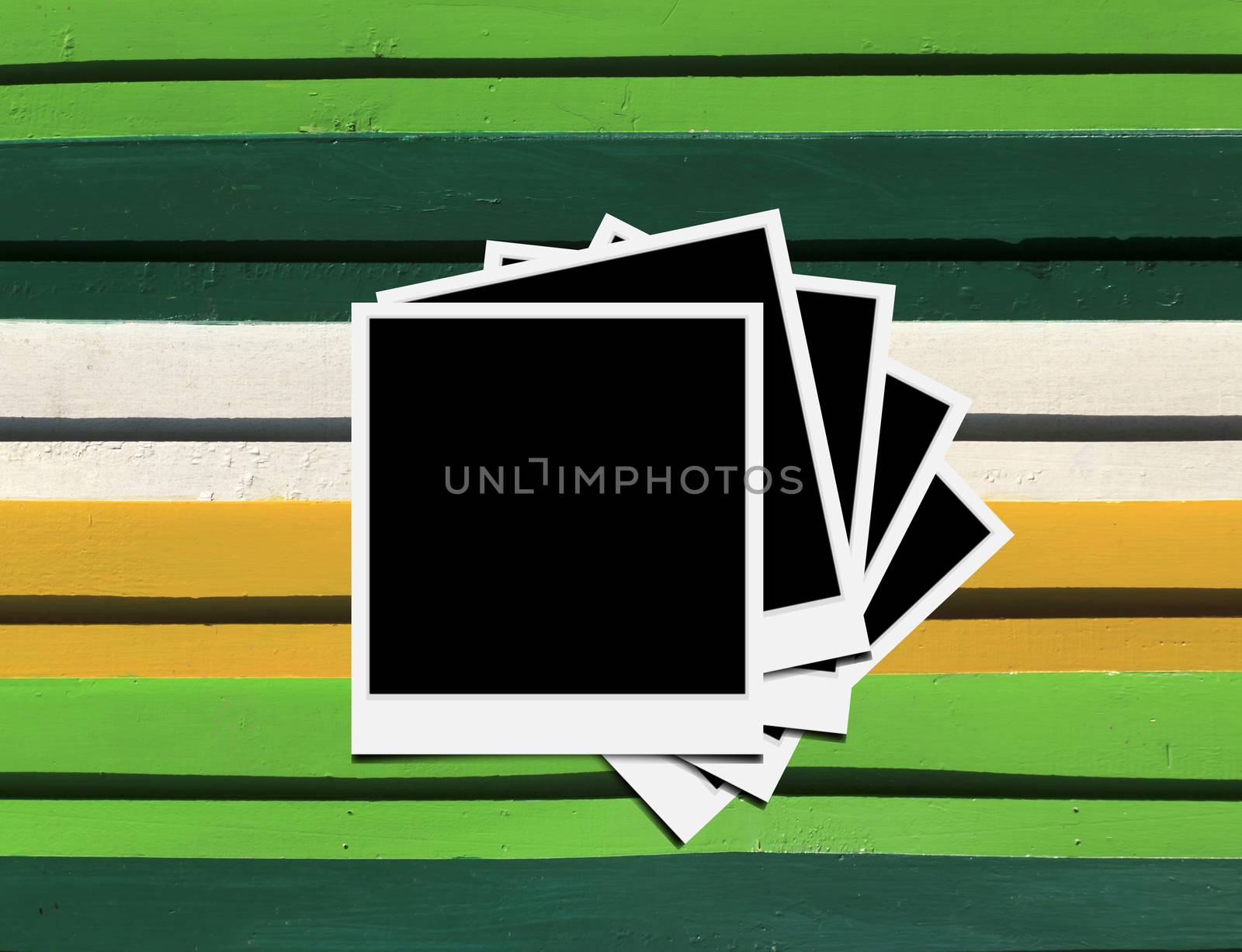 Blank instant photo frames on Wooden floor. 