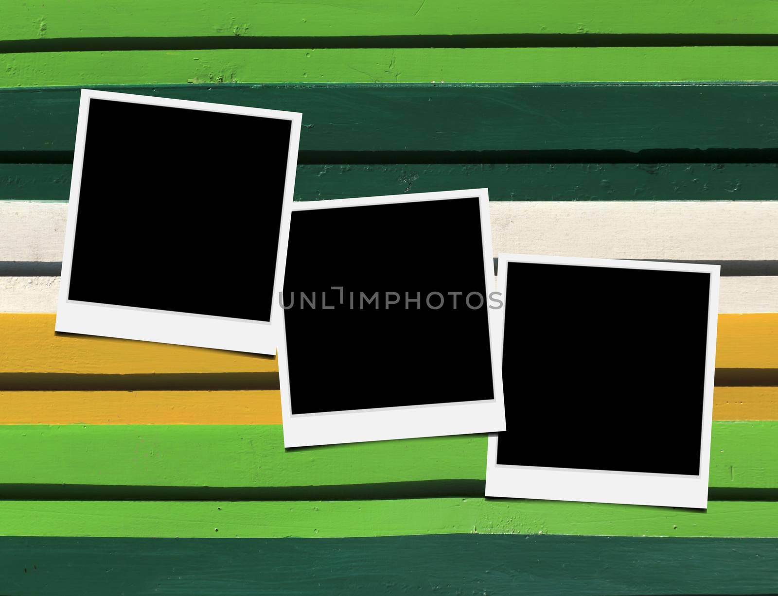 Blank instant photo frames on Wooden floor. 