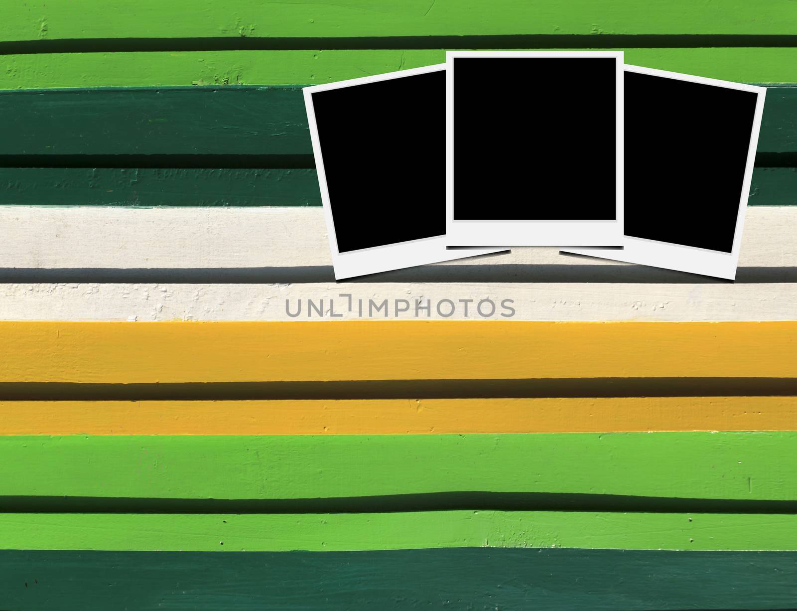 Blank instant photo frames on Wooden floor. 