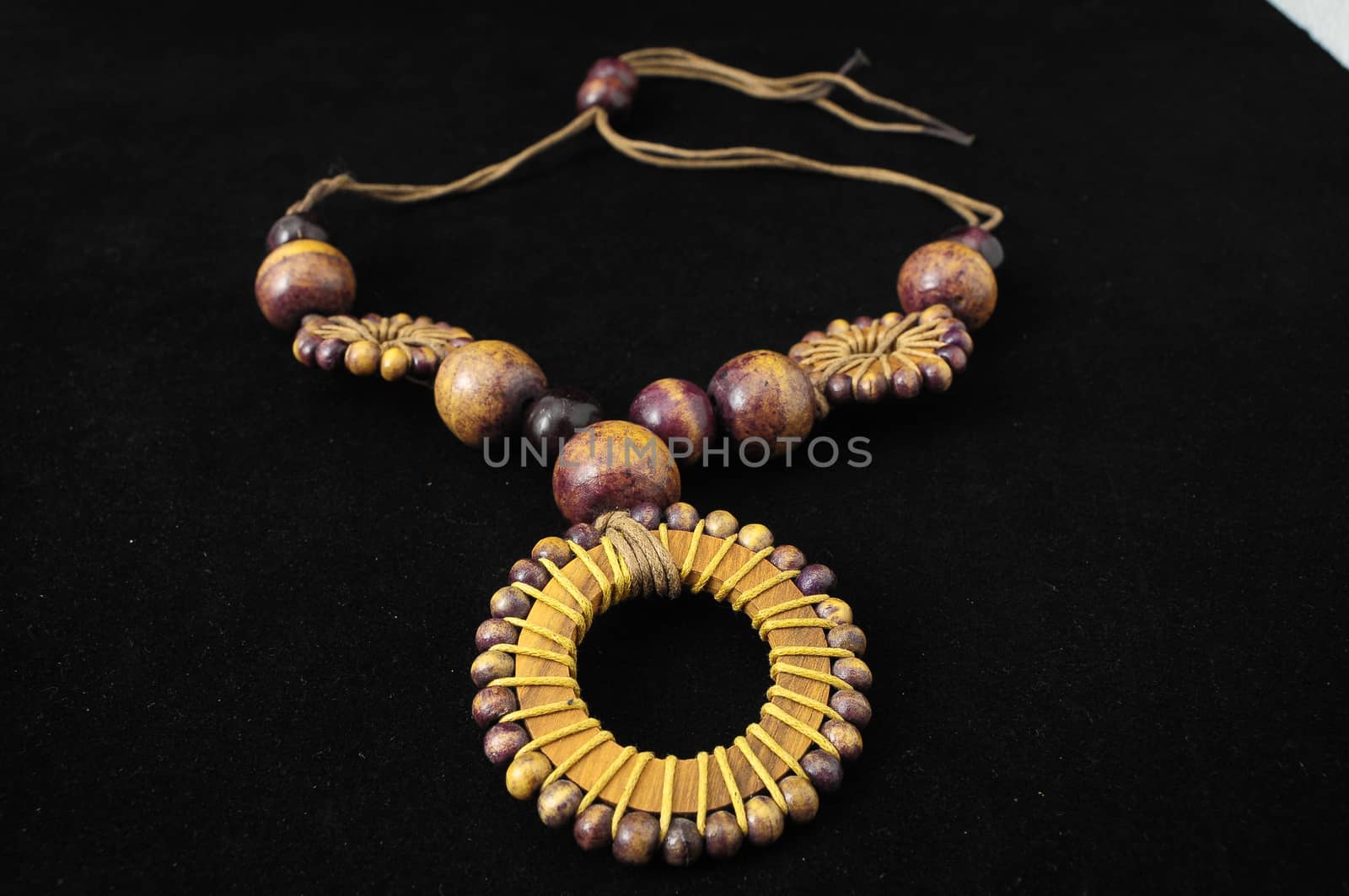 Handmade Wood Collar Necklace on a Black Background