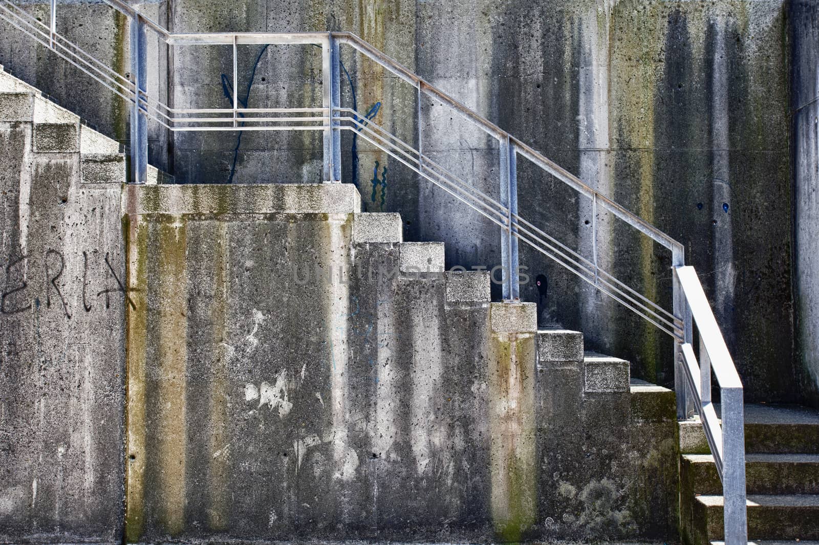 Aged concrete grunge wall with stairs by demachy