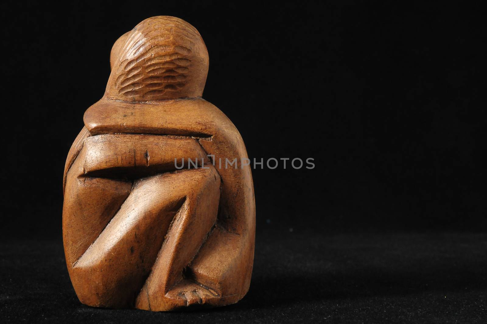 Lovers Sculpture made of Wood on a Black Background