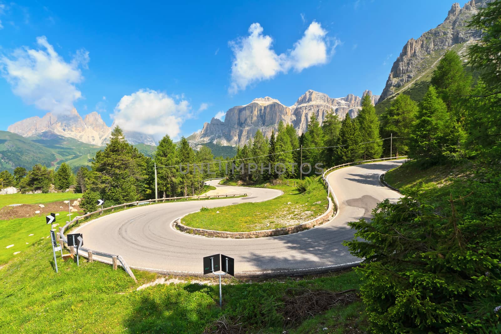 Dolomiti. winding road from Canazei to Pordoi pass, Trentino, Italy