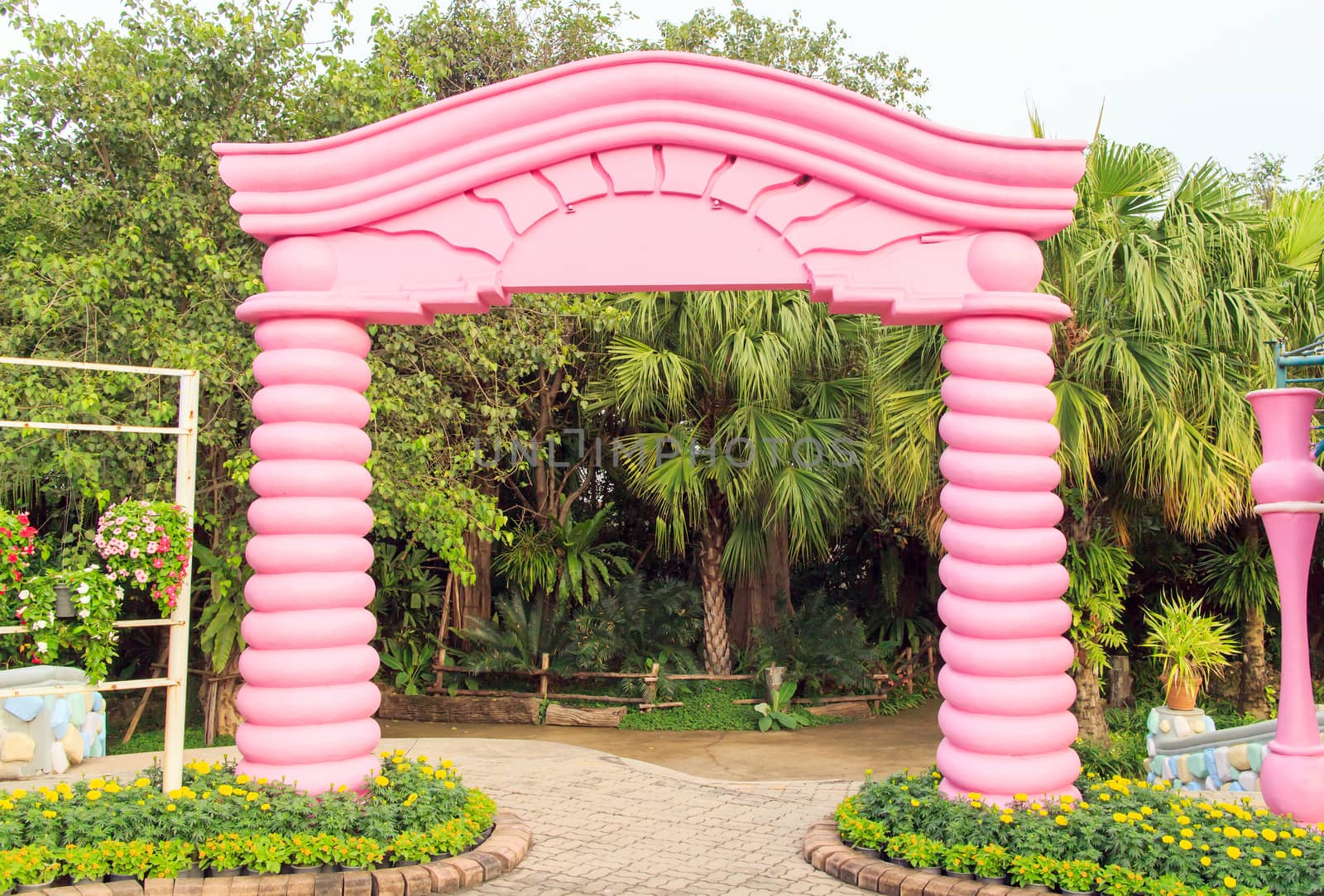 Arch molding decorates on the flower garden.