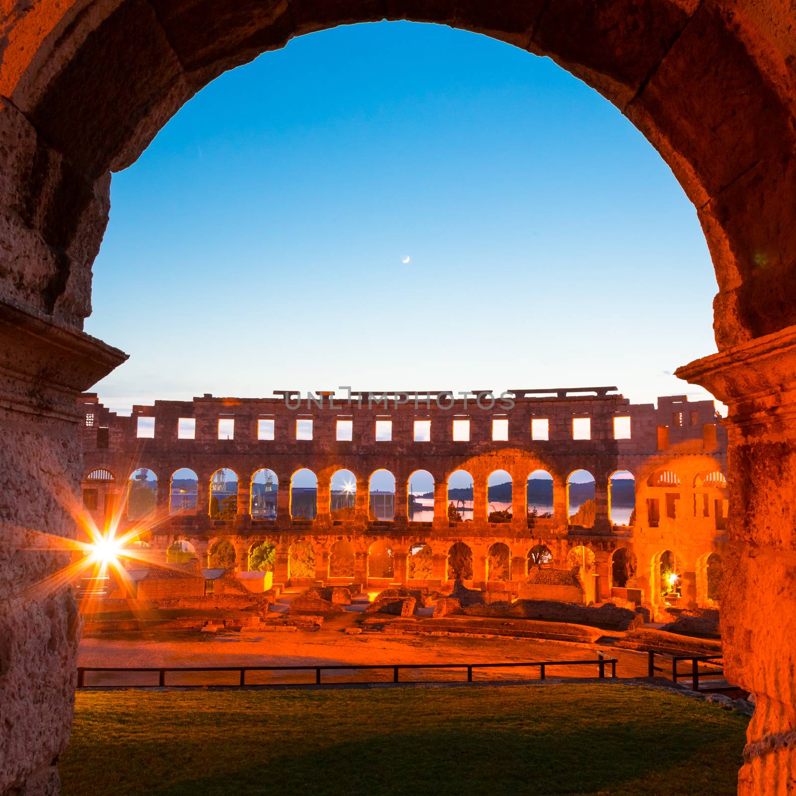 The Roman Amphitheater of Pula, Croatia shot at dusk. It was constructed in 27 - 68 AD and is among the six largest surviving Roman arenas in the World and best preserved ancient monument in Croatia.