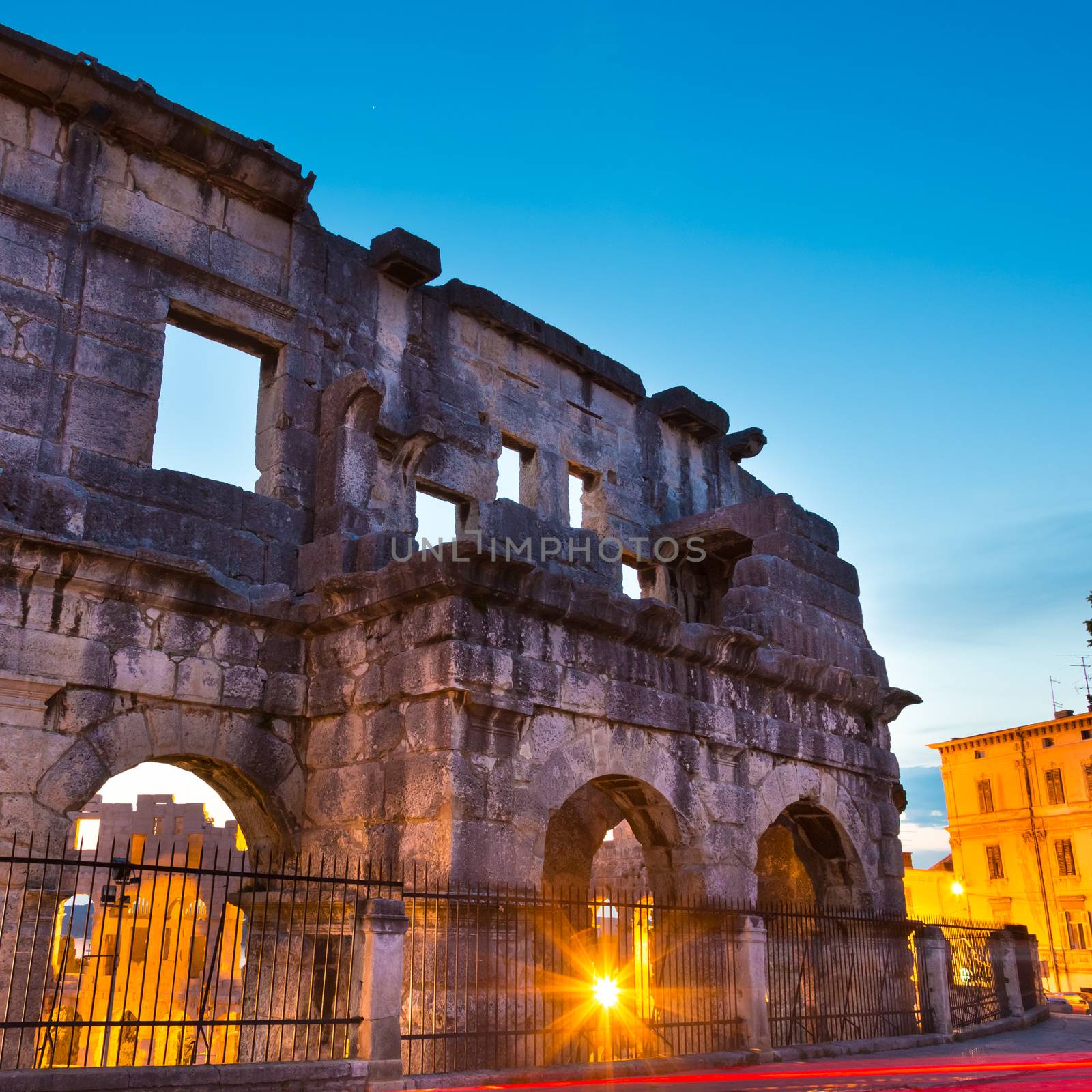 The Roman Amphitheater of Pula, Croatia shot at dusk. It was constructed in 27 - 68 AD and is among the six largest surviving Roman arenas in the World and best preserved ancient monument in Croatia.