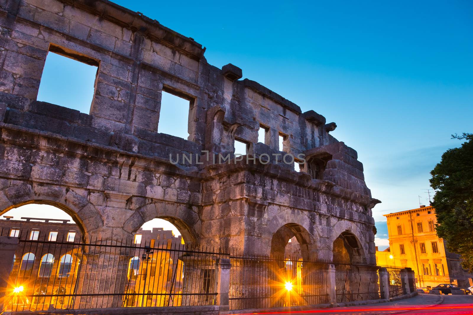 The Roman Amphitheater of Pula, Croatia shot at dusk. It was constructed in 27 - 68 AD and is among the six largest surviving Roman arenas in the World and best preserved ancient monument in Croatia.