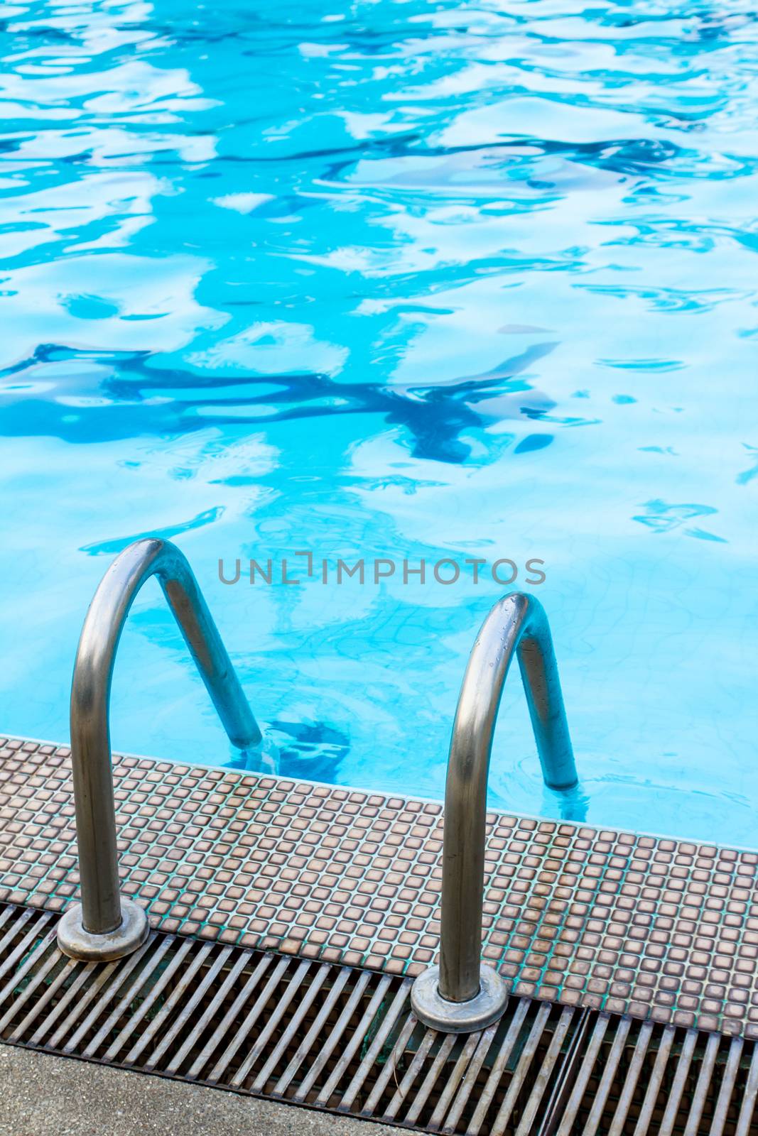 Grab bar steel ladder in swimming pool