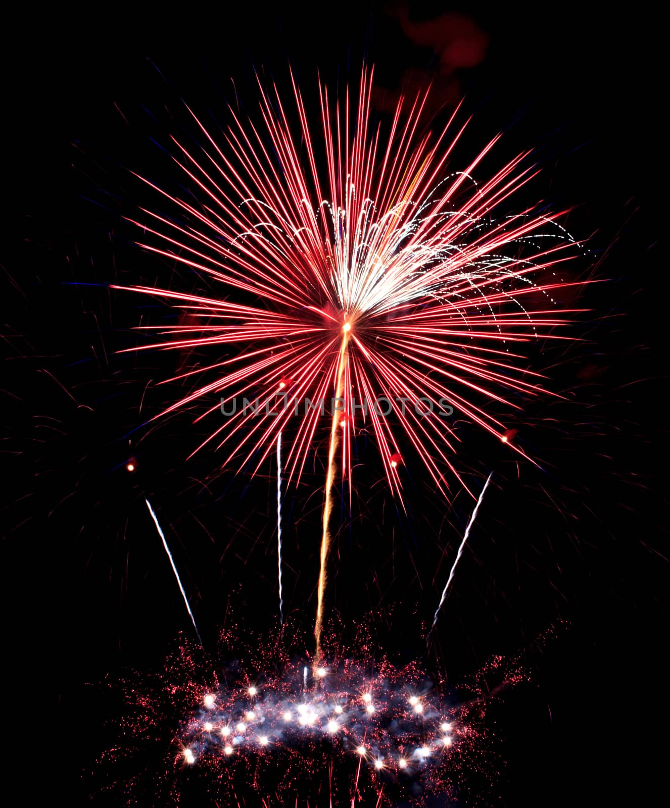 Exposure of multiple fireworks with a black sky.