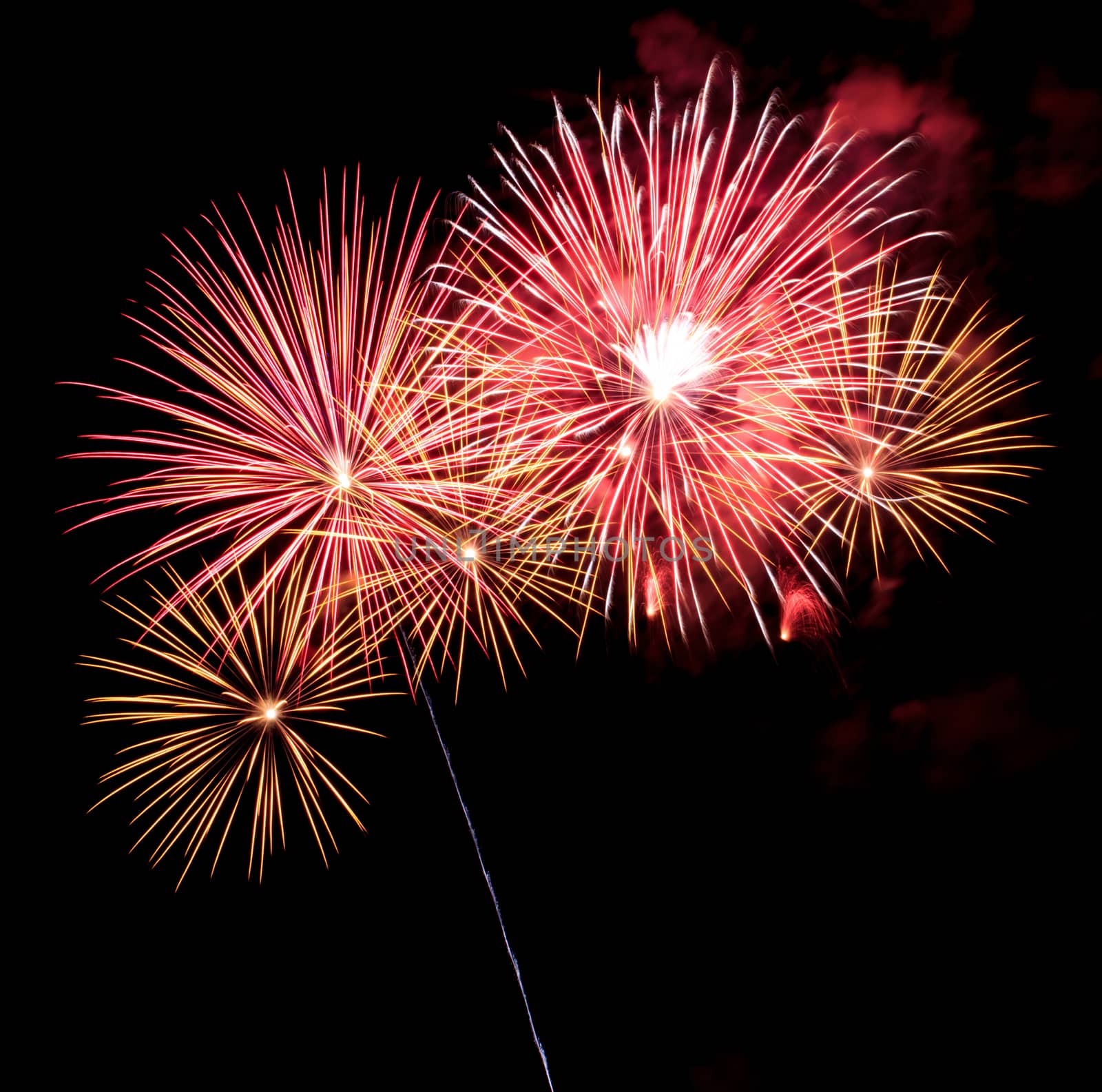Exposure of multiple fireworks with a black sky.
