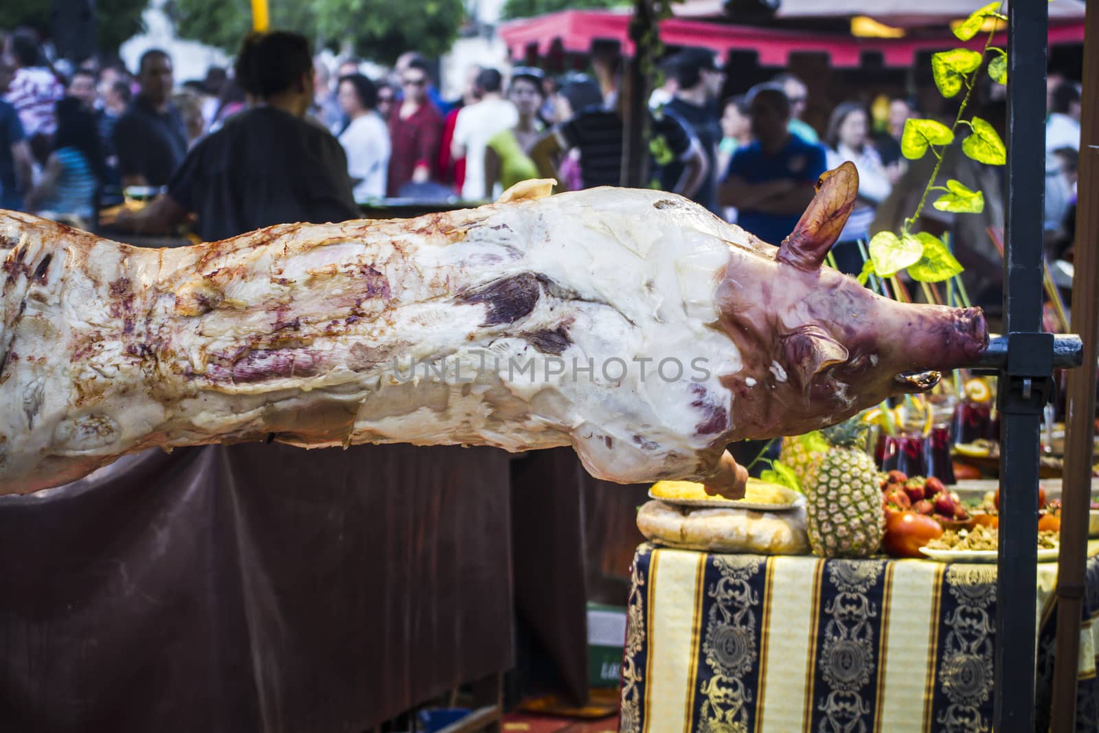 huge grilled pork fact, medieval fair in Spain by FernandoCortes