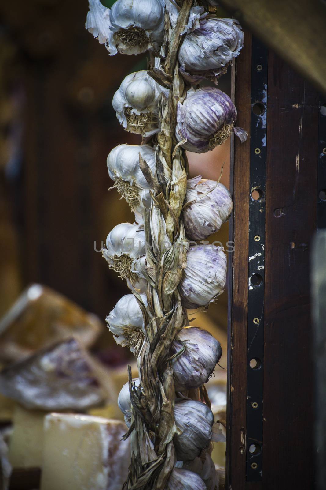 lot of garlic in a medieval fair, kitchen condiments by FernandoCortes