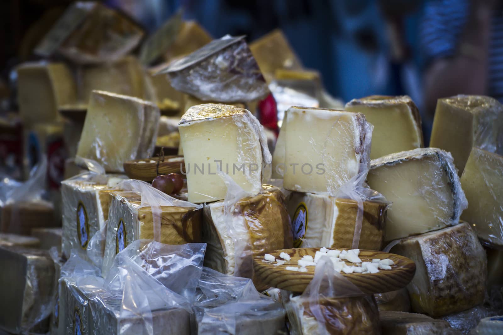 batch of cheese in a medieval fair, artisan cheese by FernandoCortes