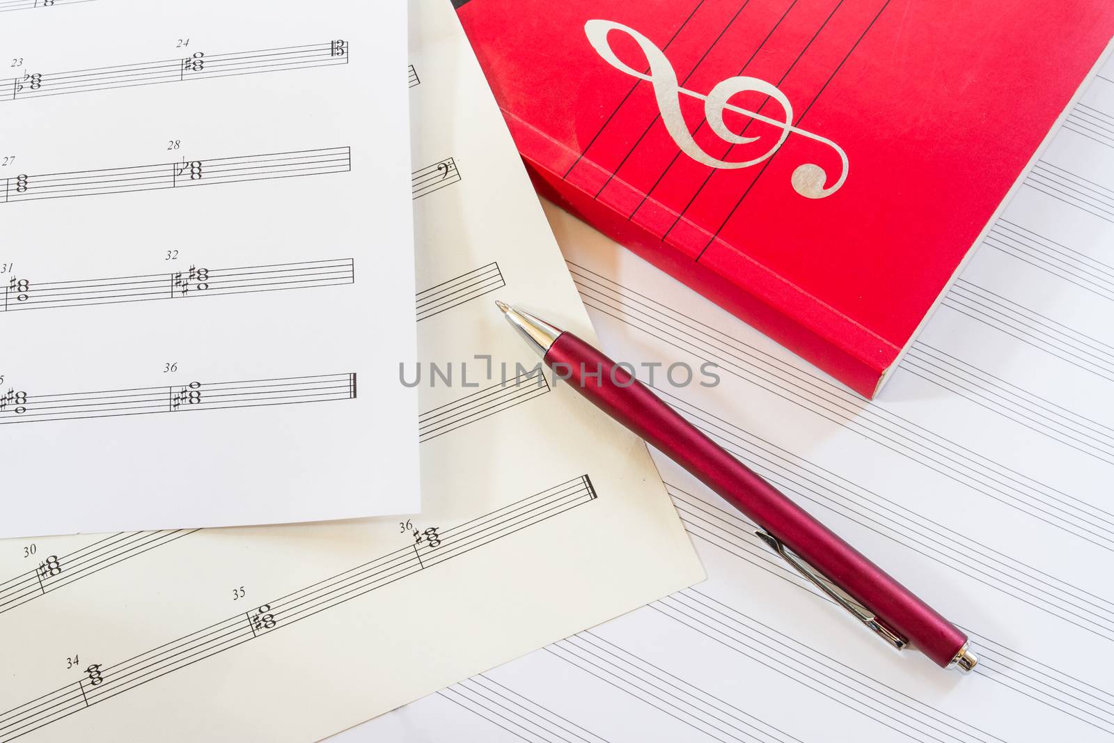Sheet music with pen and music book