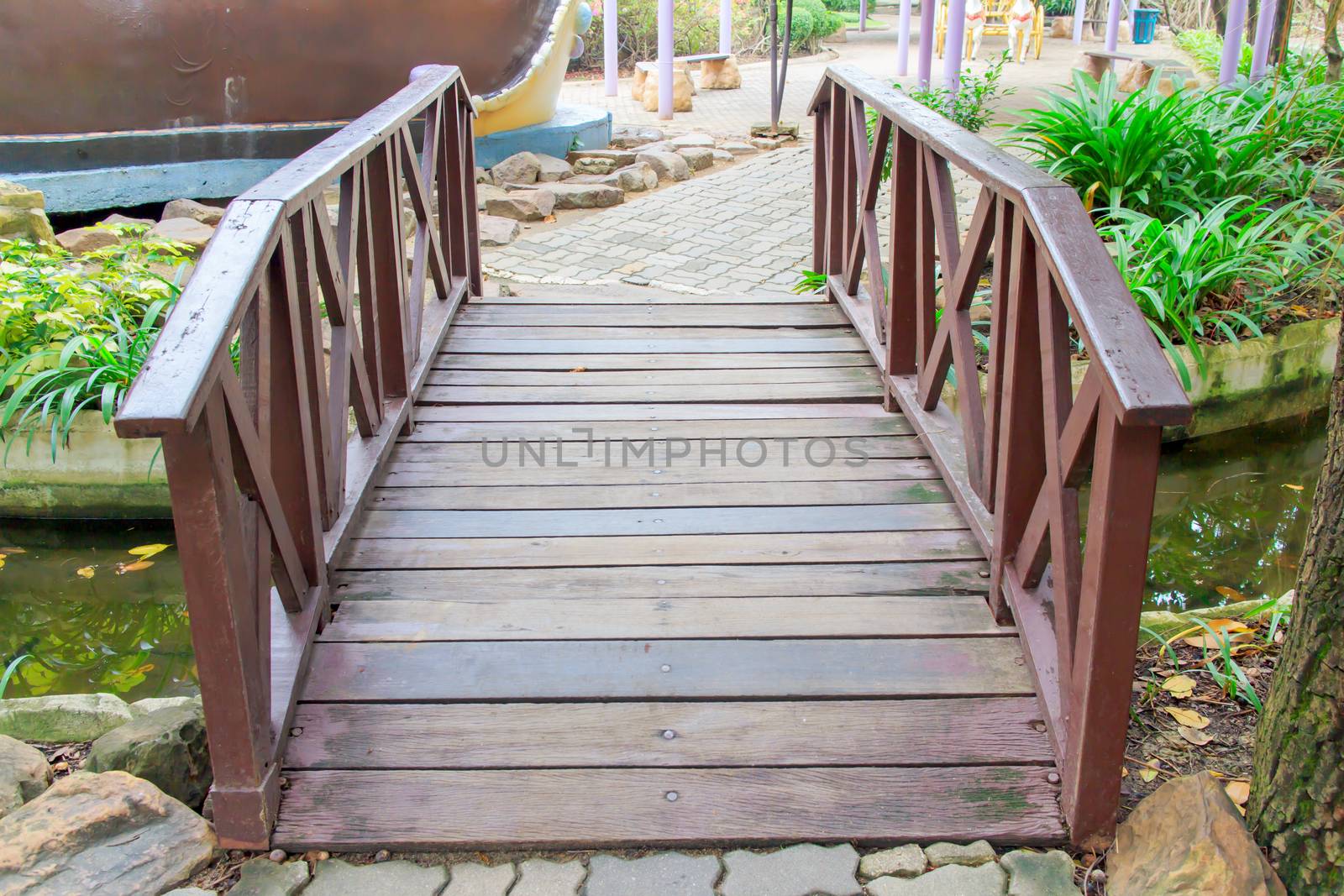 Wood bridge across the canal for a short distance.