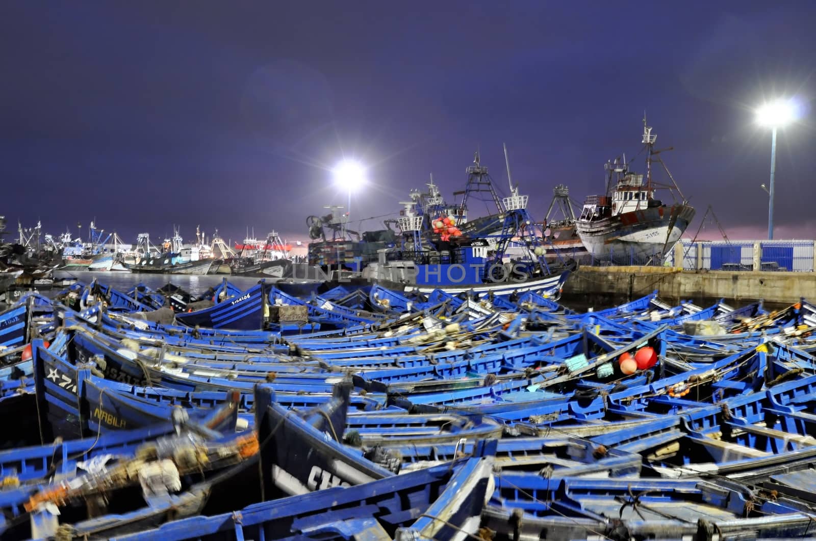 Blue fishing boats of Essaouira at night by anderm