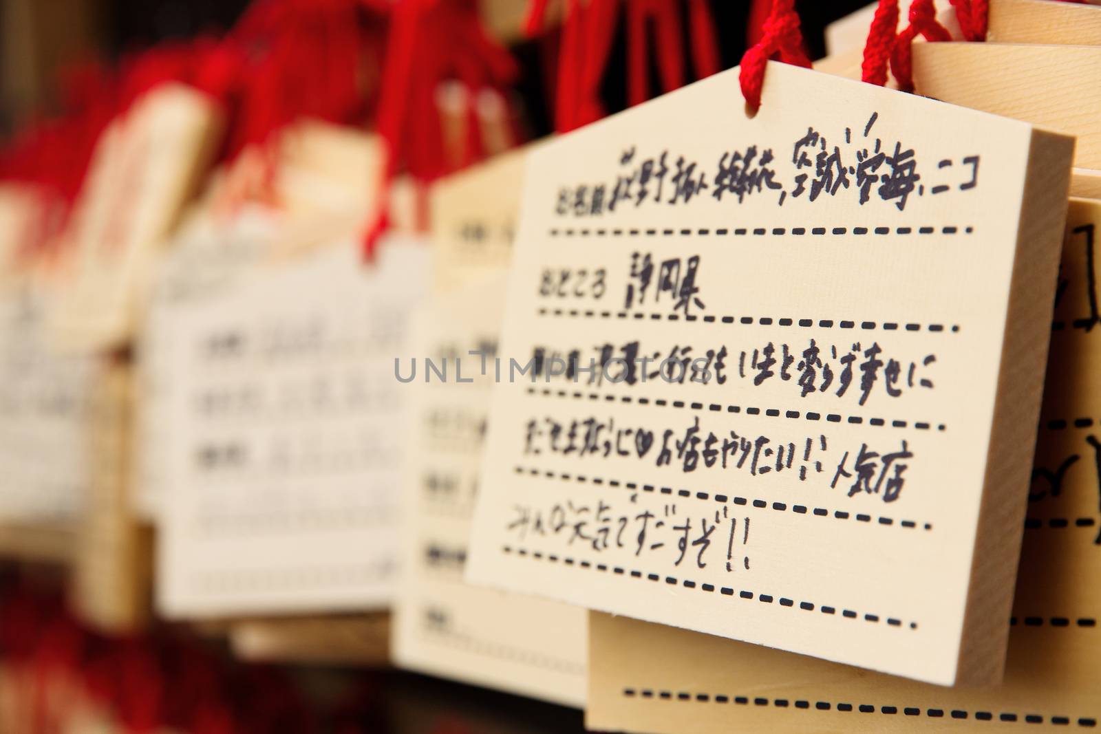 Ema prayer tables at a shrine in Ueno Park In Japan ,Pray for happiness,good life , healthy , luck by write praying word in wooden tablet.