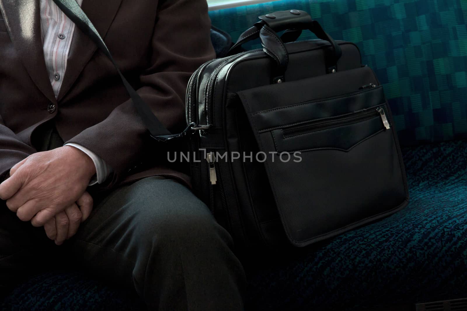 Japanese Businessmen sitting on seat in train