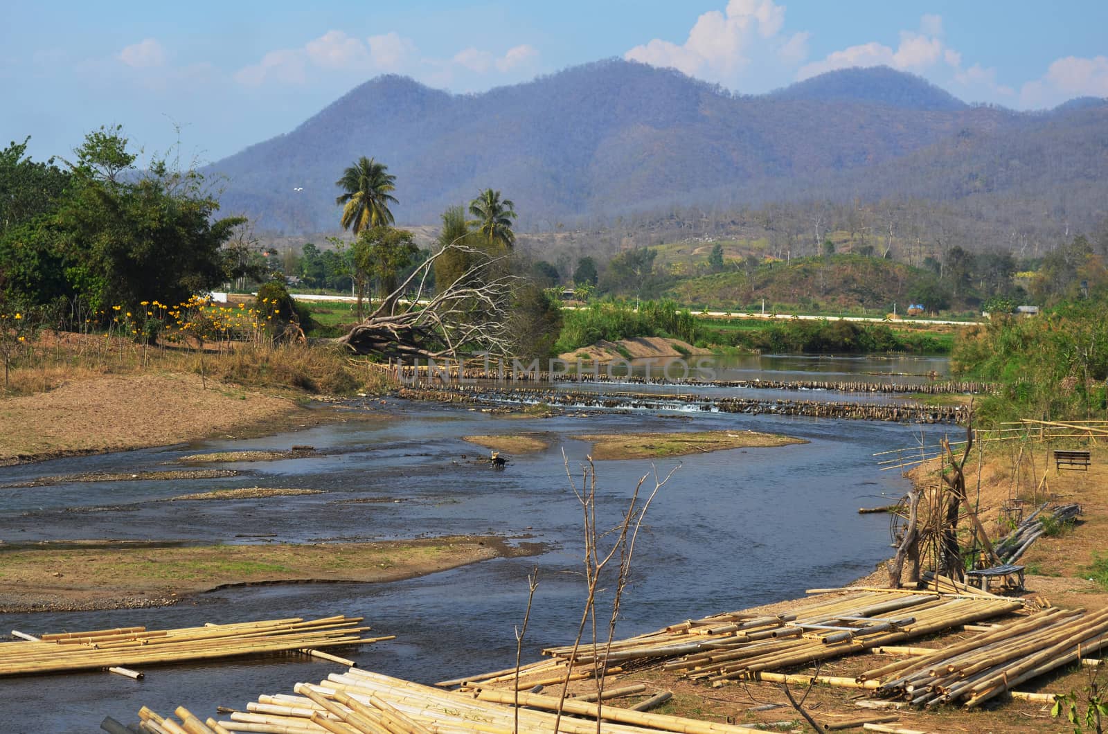 Lanscape of Canal and Weir, Rural Road and Mountain Background,  by kobfujar