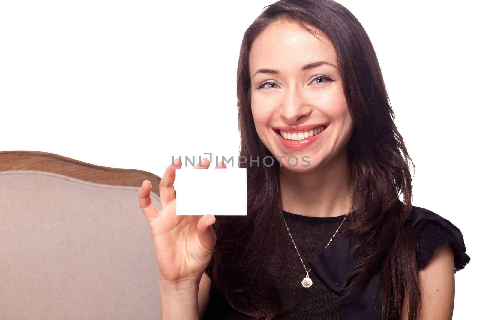 Smiling young woman holding blank businesscard by Kor