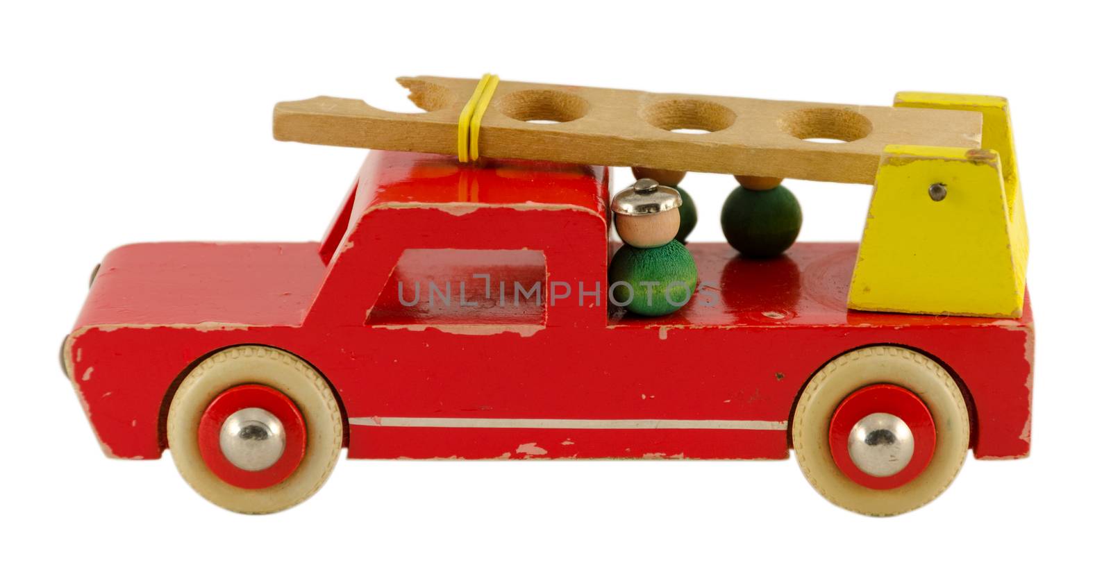 antique wooden fire-engine toy isoalted on white by sauletas