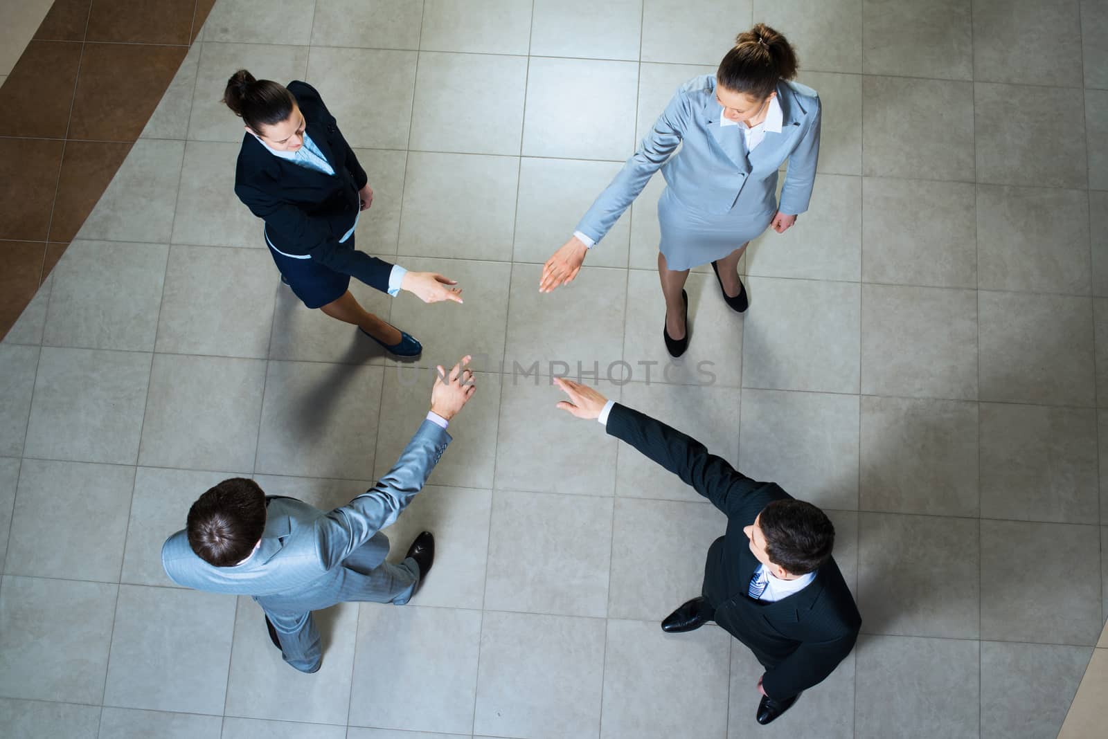hands of businesspeople together by adam121