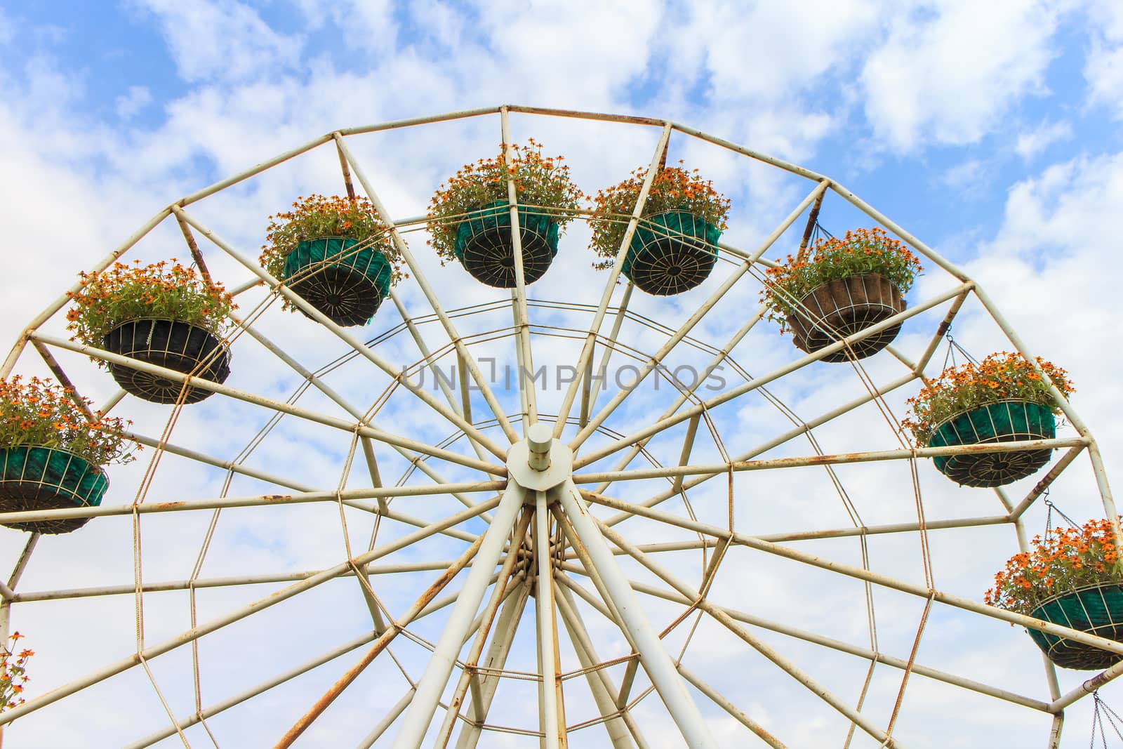 Flower pot is on the ferris wheel.