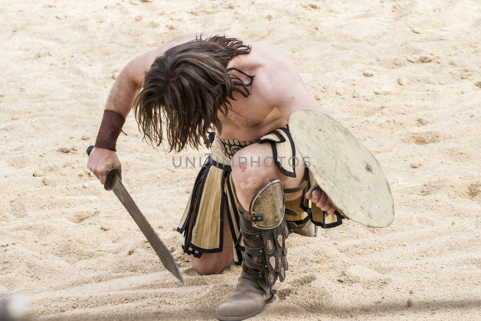 Proud, gladiator fighting in the arena of Roman circus