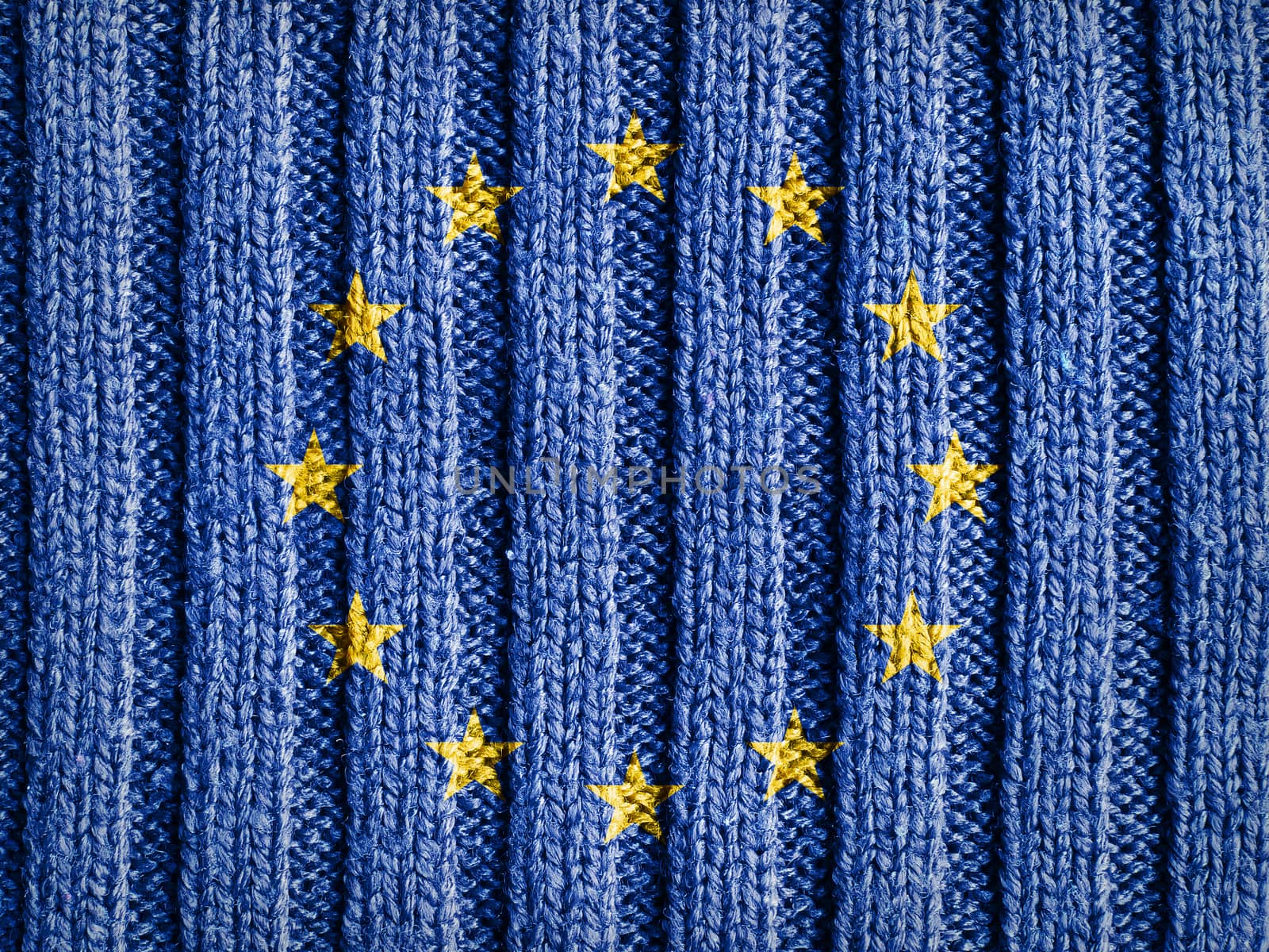 Close-up view of wool fabric pattern with the flag and emblem of Europe. European Union background.