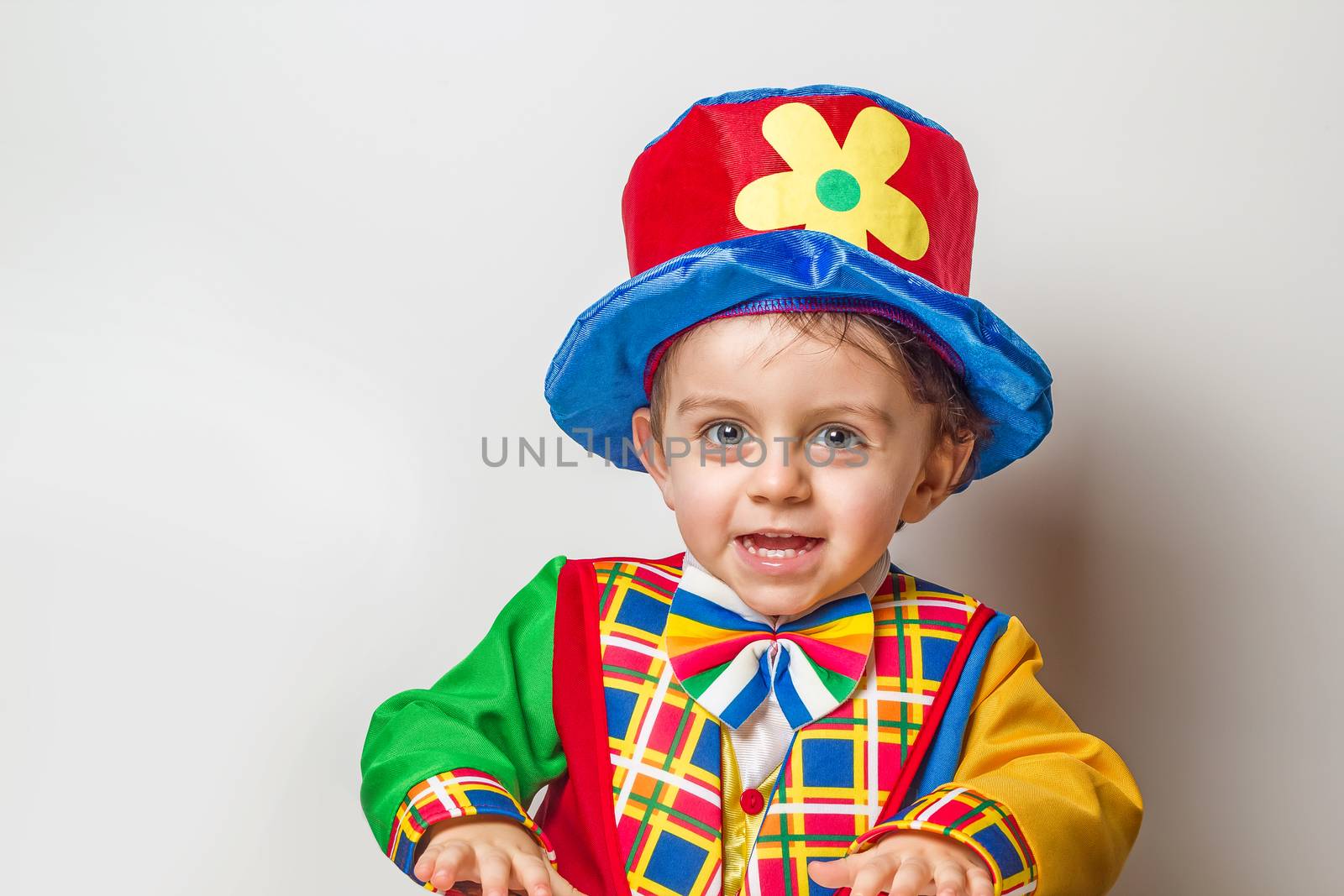 Child in clown suit by dynamicfoto