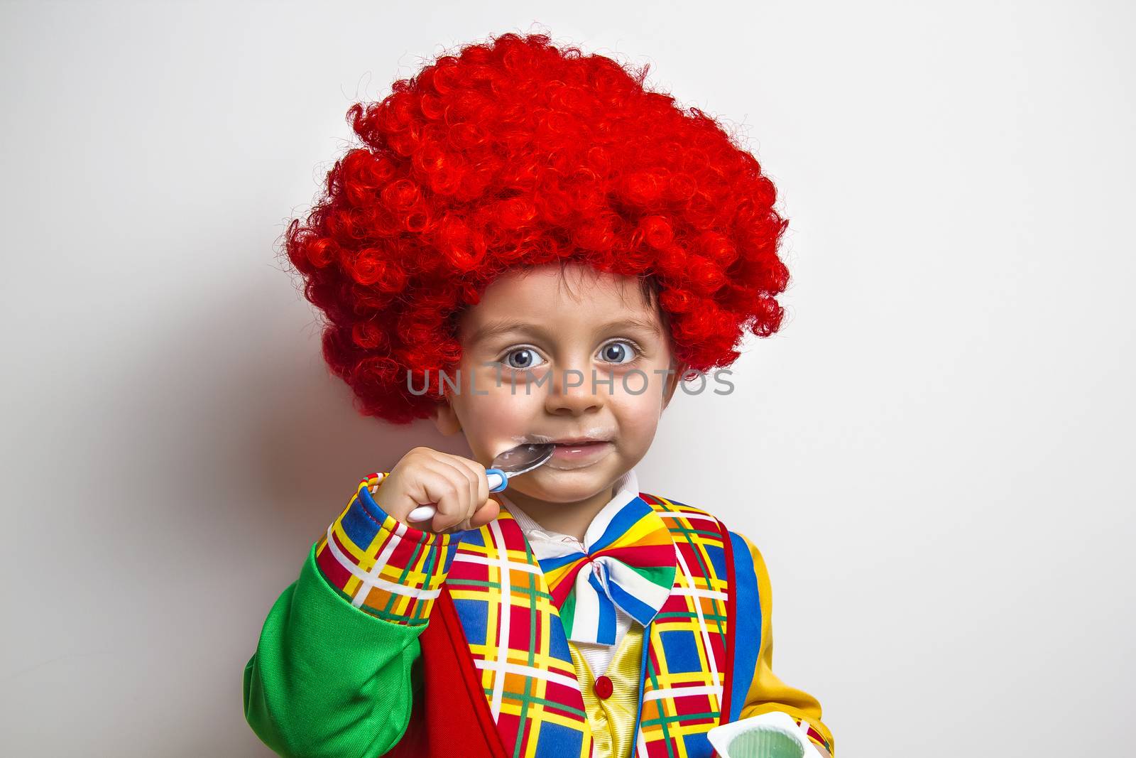 Funny Child wearing a clown suit