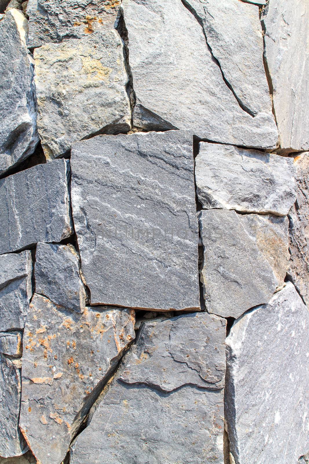 Walls built from natural stone for background image.