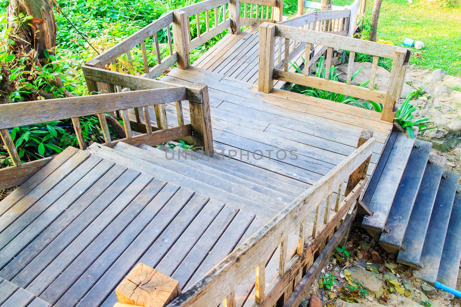 Old wooden stairs is way down at the home garden.